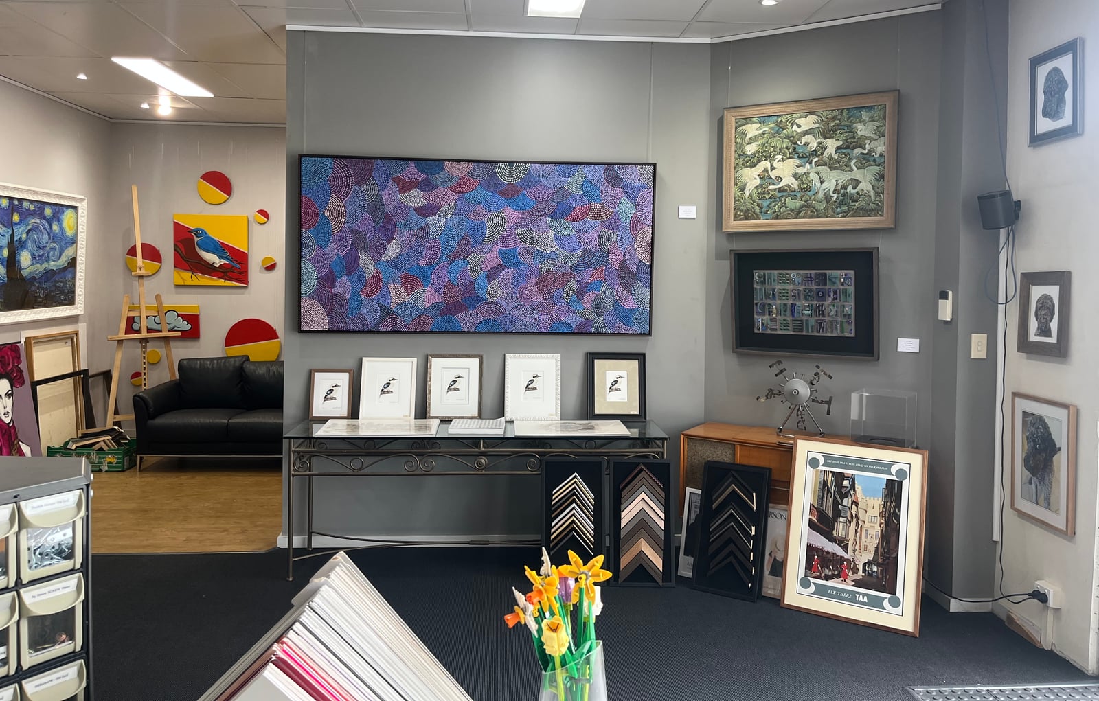 Framed paintings, prints and display pieces inside the showroom